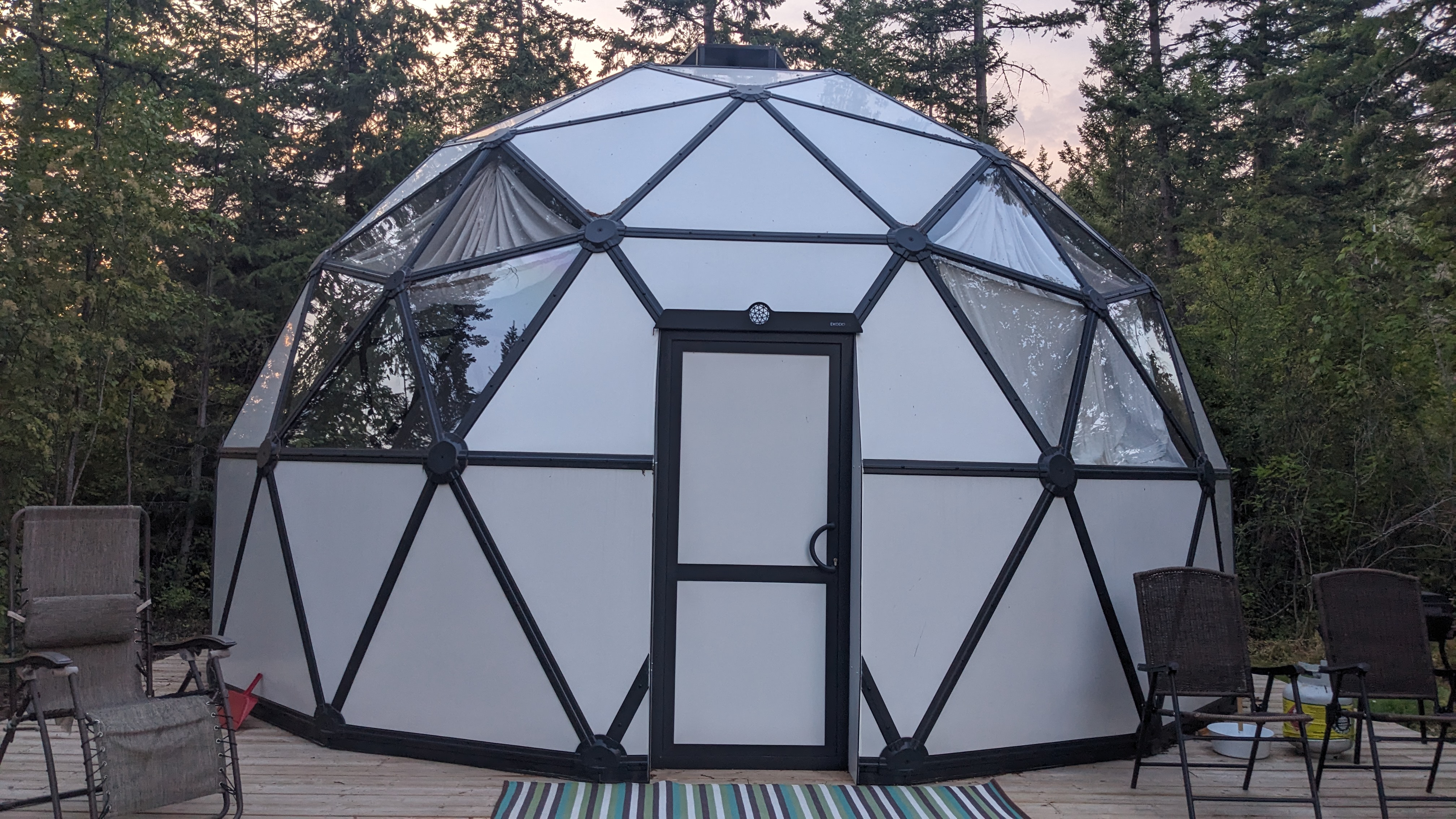 Welcoming front view of the dome with comfortable deck seating